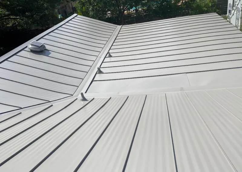 Solar attic fan installed on a metal roof for Roof Ventilation in Richmond